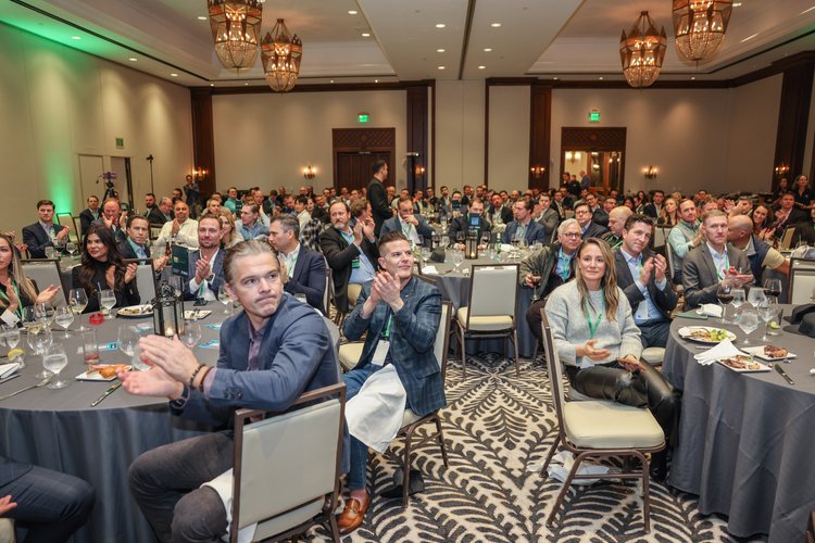Group of people clapping at an event